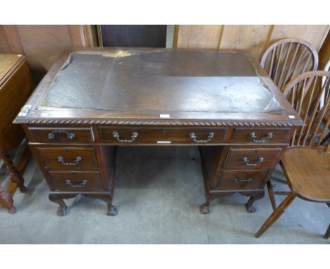 An Edward VII Chippendale Revival carved mahogany pedestal desk 