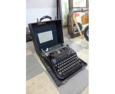 A vintage cased Remington Victor S Portable typewriter 