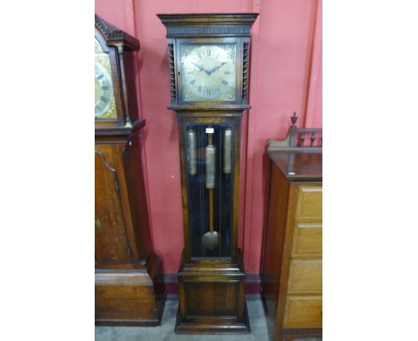 An early 20th Century oak triple weight longcase clock 