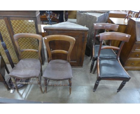 An oak bookcase, an oak corner cupboard, a standard lamp and five assorted chairs 