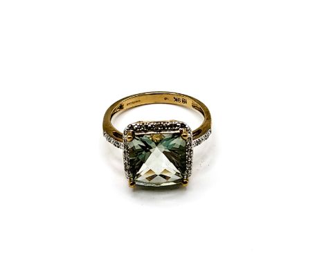 A 9ct yellow gold and prasiolite ring, set with a chequerboard faceted green quartz, surrounded with diamond accents, size R.