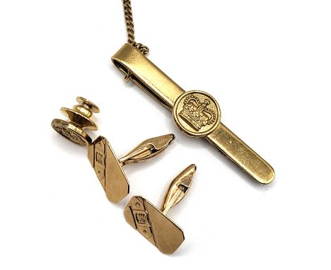 A pair of 9ct yellow gold cufflinks (3 gms), together with a silver gilt tie clip bearing Crown motif, and matching silver gi