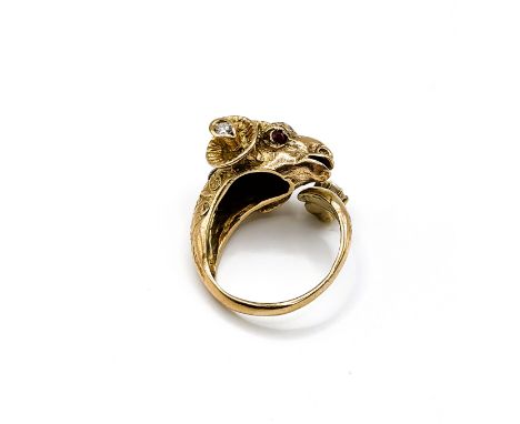 An unusual Greek yellow gold and diamond ring in the form of a ram's head, set with ruby eyes and small diamonds (one replace