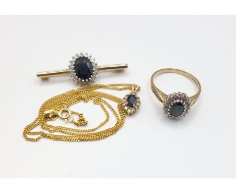 A 9ct yellow gold diamond, and sapphire cluster ring, size P 1/2, together with a 9ct yellow gold and sapphire bar brooch, an