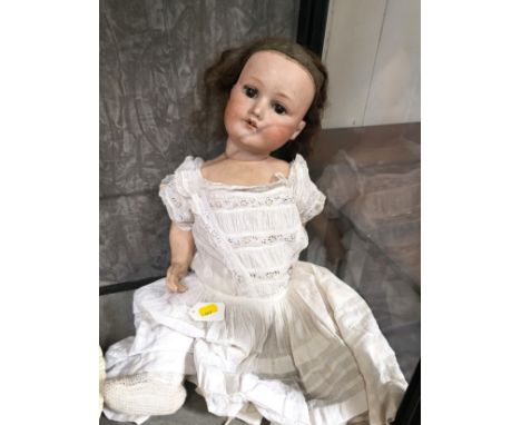 An M. Bergmann Waltershausen 1916/ 10 bisque head doll, sleeping brown eyes, open mouth with two three teeth (one missing), a