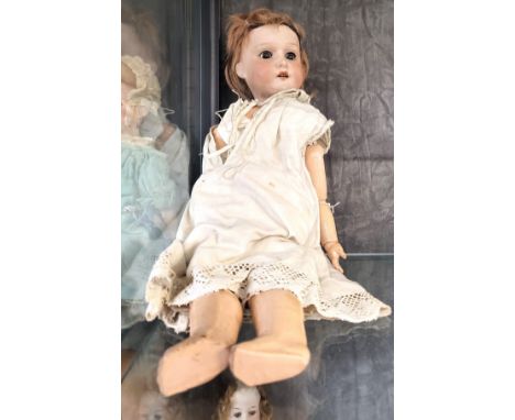 A Heubach 275.8  bisque head doll with sleeping brown eyes, open mouth and jointed cloth body, 38cm. 