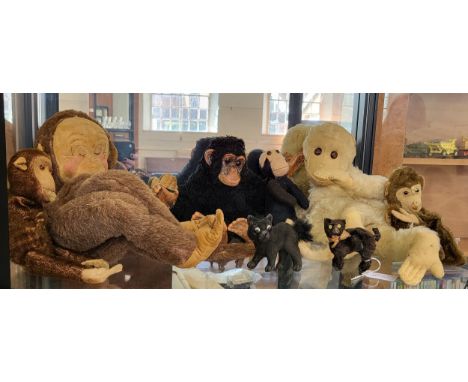 A Merrythough monkey bag 60cm, a monkey glove puppet 21cm, a Dean's black monkey with label 31cm, a felt monkey 21cm, two sma