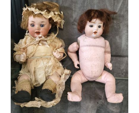 Two German bisque head dolls: 914 4/0 with sleeping blue eyes, 22cm and 121 10/0 with fixed blue eyes, 23cm. (2) 