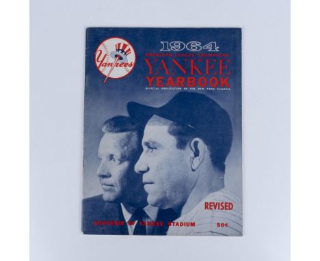 The official Yankees yearbook, featuring Yogi Berra on the cover, showcases the full roster of players, highlighting their ta