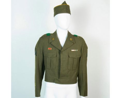 Jacket has collar brass with corporal stripes. Ribbon over right pocket and ribbon bar over left pocket (good conduct and Eur