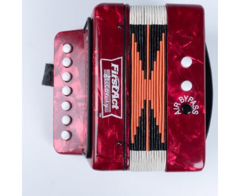 This charming vintage musical instrument features a stunning red, pearl-like coloration, a variety of keys and modes, and is 