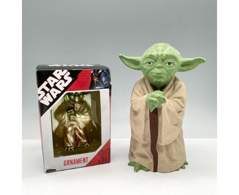 Rubber hand puppet colored in brown and green (5.5"L x 4.5"W x 8.5"H). New in box-unopened, Yoda ornament holding his light s