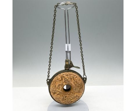 Unique replica of the 18th century flask carried for reloading firearms. This round carved or molded resin circular container