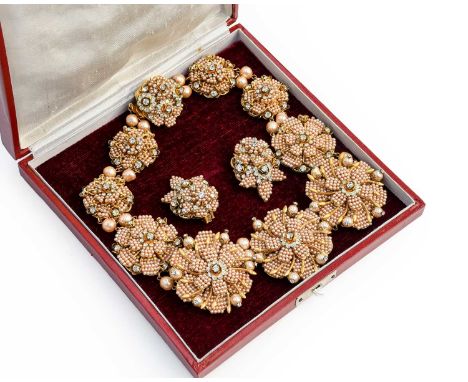 A Simulated Pearl and Paste Necklace, by Stanley Hagler, formed of ten chain linked circular plaques realistically modelled a