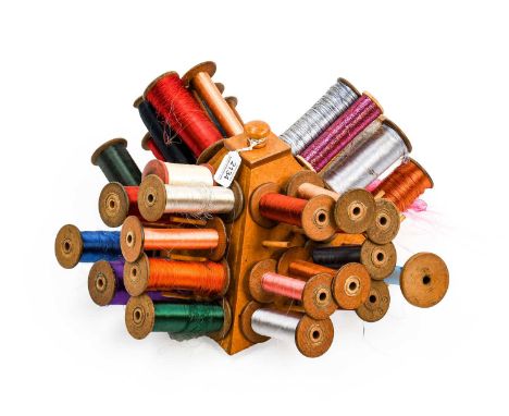 A Pyramid Shaped Bobbin Holder, with a collection of large wooden bobbins and mainly metallic threads, 24cm by 23cm high
