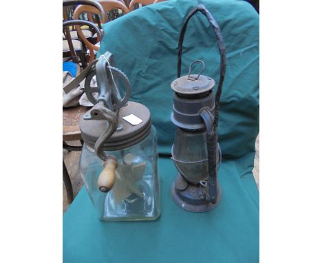 Early butter churn and paraffin lamp