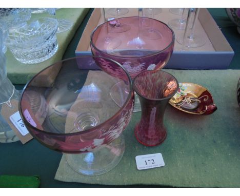 Pair of Cranberry decorative dessert glasses with raised decoration of a young piper, small decorative ruby glass posy vase a