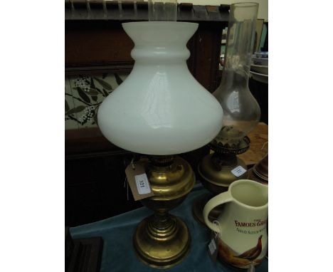 Brass oil lamp with clouded glass shade