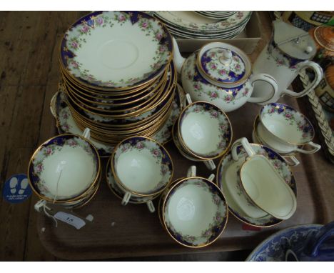 Early 20th century Aynsley white ground bone china tea service incl. pot, border richly decorated in gilt and cobalt blue ins