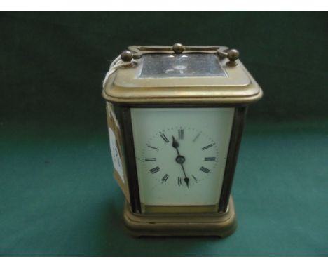 Brass carriage clock the enamel dial painted roman numerals 