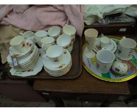 White ground orange and apple green floral patterned bone china tea service (12 place setting - 21 pieces) together with 5 pi