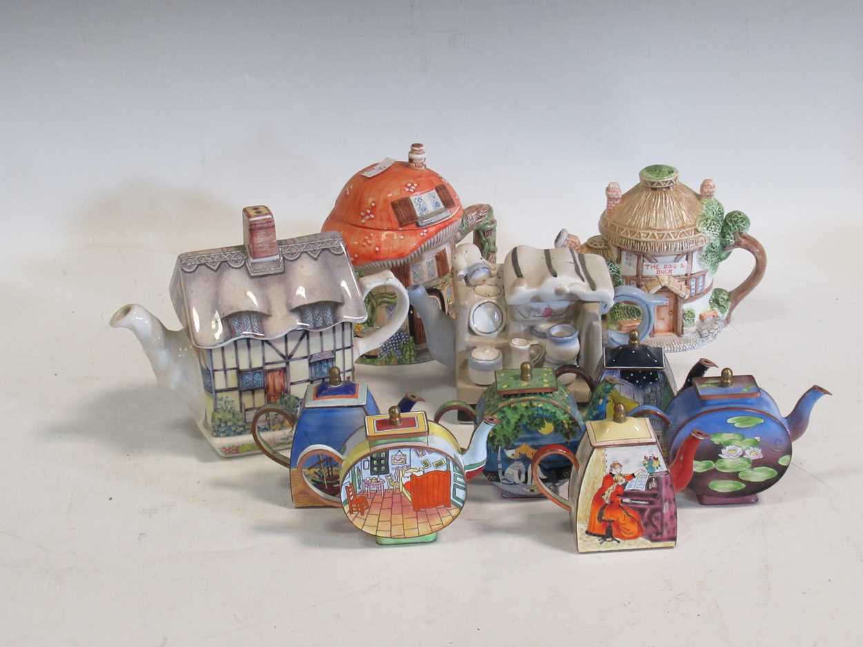 A large collection of modern minature decorative teapots (quantity) in