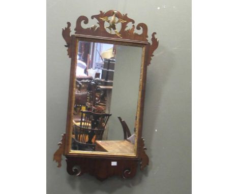 A mahogany tea caddy, a fretwork wall mirror, and a pair of balloon back dining chairs