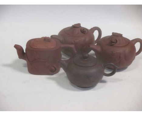 A Chinese Republic period red stoneware teapot; three other red stoneware teapots (4)