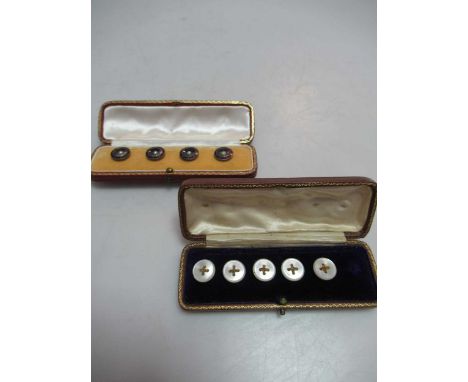 A boxed set of five mother of pearl knot buttons, (5/6), together with a boxed set of four pearl and enamel buttons
