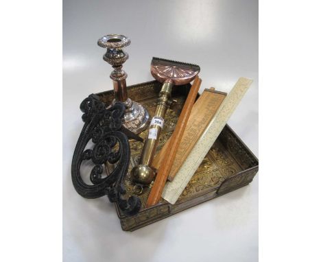 An Aesthetic movement brass tray, horse hair singer, trivet, 3 rulers and a plated candlestick