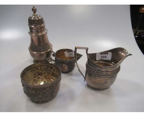 A silver milk jug, sugar basin, cream jug and caster, together with various silver knives and forks