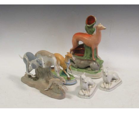 A Staffordshire model of two Greyhounds, a Mallorcan porcelain coursing group, a pair of Italian white glazed porcelain model