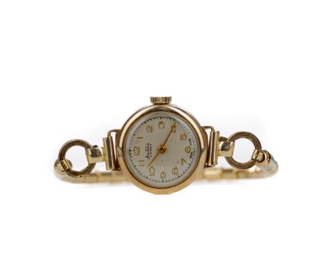 LADY'S NINE CARAT GOLD CASED BENTIMA STAR MANUAL WIND WRIST WATCH, the round cream dial with gold coloured applied Arabic hou