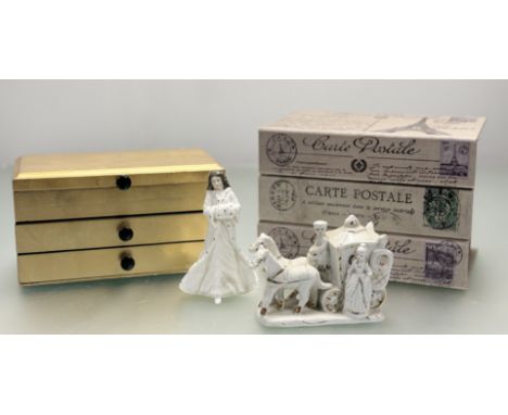 A Royal Doulton Christmas Day figure (h-16cm), a white porcleain figure of a Lady walking out a horse and carriage, with gilt