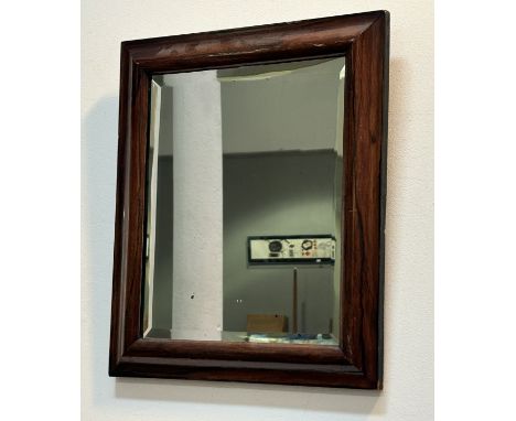 A 19thc rosewood cushion framed wall mirror with bevelled glass panel. (43cmx37cm)