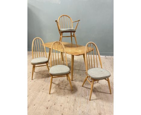 A 1960s Ercol elm and ash six piece dining room suite comprising dining table with curved angles on splayed supports: h. x 72