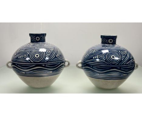 A pair of ceramic white crackle glaze with blue swirl decoration bulbous vases, both with twin handles to side. (h-30.5cm) (2