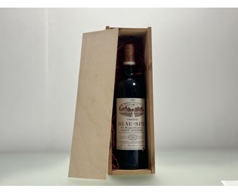 A bottle of 2000 Chateau Beau-Site Saint-Estèphe, Médoc, Bordeaux, France, seal intact, small tear to bottom corner label, in