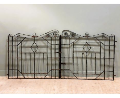 A vintage pair of wrought iron driveway gates with catch and push-down locking post in distressed black enamel: h. x 106cm to
