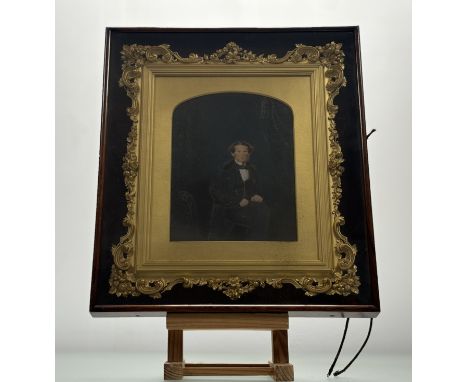 A pair of English School Victorian Portraits, one of seated Gentleman wearing a bow-tie with a timepiece chain the other of a
