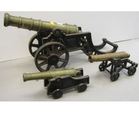 CANNONS, scale model brass and iron cannon on carriage, 29cm cannon size; together with 2 smaller models