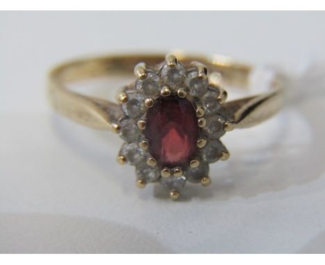 GARNET CLUSTER RING, 9ct yellow gold ring, set an oval garnet within a cluster, size L