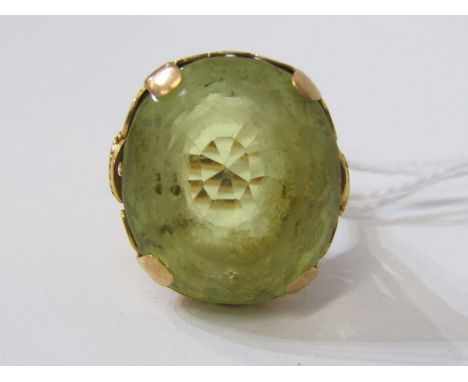 LARGE PERIDOT RING, heavy yellow gold setting, tests as 18ct, set a large oval peridot, 20mm diameter, size R/S (purchased in