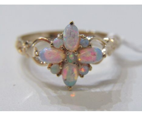 OPAL CLUSTER RING, 9ct yellow gold ring set with a star form cluster of opals size O