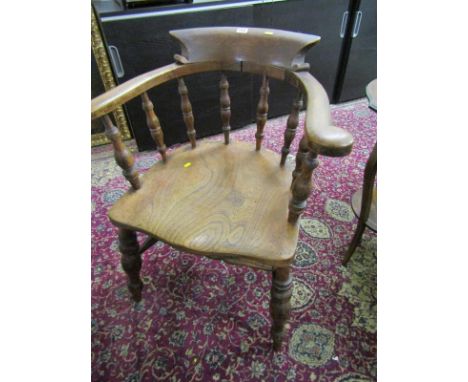 CAPTAIN'S SPINDLE BACK ARMCHAIR, shaped elm seat with double H stretcher  Lot 660: Splits to back section, some light signs o