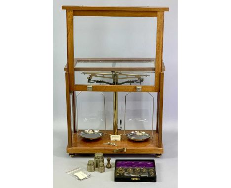 PHILIP HARRIS LTD BIRMINGHAM CHEMIST'S SCALES in glazed mahogany case on adjustable gilded brass feet, 37cms H 39.5cms W, 20c