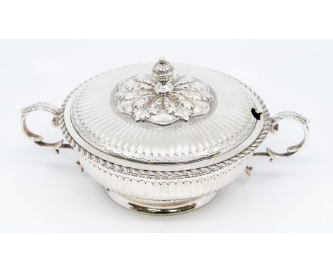 An Edwardian silver two handled small tureen and cover, gilt lined, the body with fluted sections beneath a band of engraved 