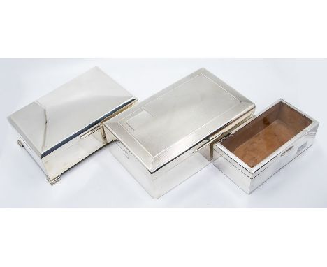 A collection of three silver cigar boxes to include: George V with engine turned decoration plain cartouche, cedar lined fitt