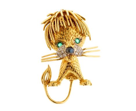 A vintage 18ct gold lion brooch, emerald set eyes with cabochon sapphire set nose, the cheeks pave set with diamonds, total e