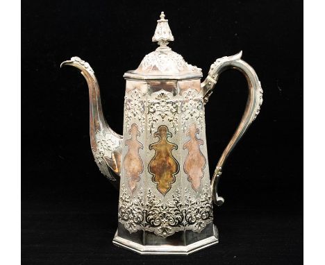 A Victorian silver tapering cylindrical coffee pot, Chinoserie style profusely chased with panels of foliage, mottling and sh